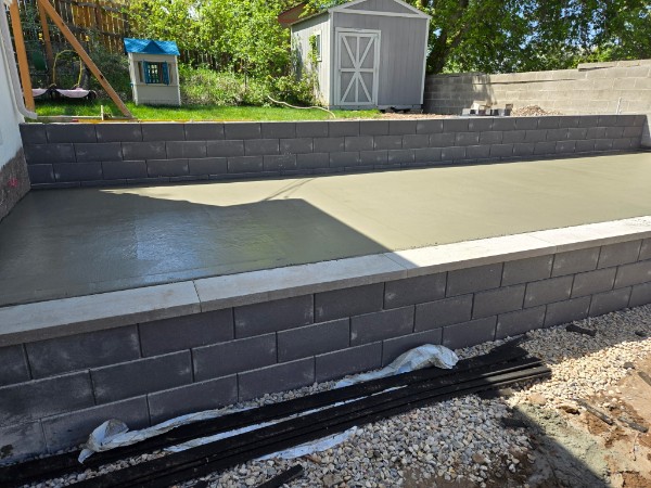 Finished concrete terrace between block retaining walls